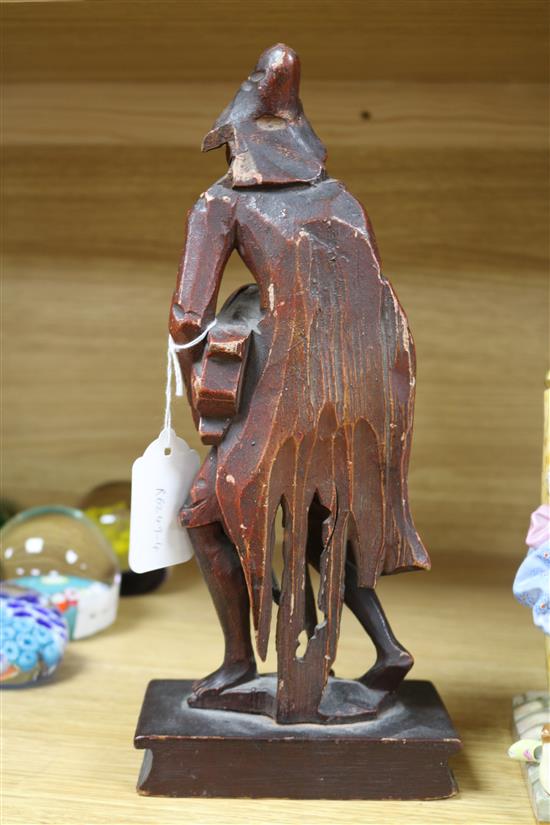 An 18th century Italian painted wood figure with a hurdy-gurdy H.29cm.